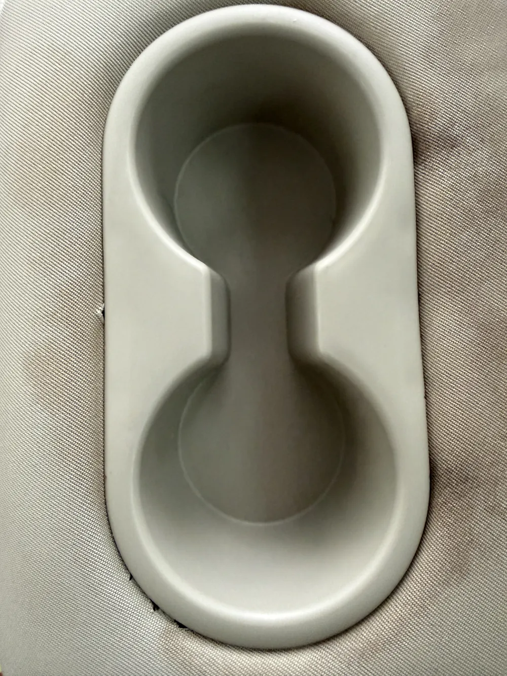 The same cup holders after — scrubbed back to clean plastic