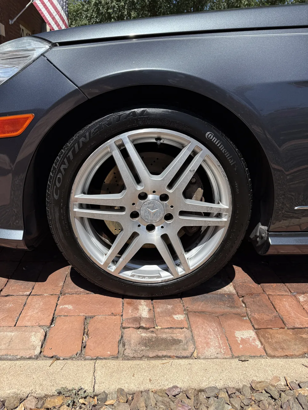 The same wheel after — brake dust off and the tire dressed