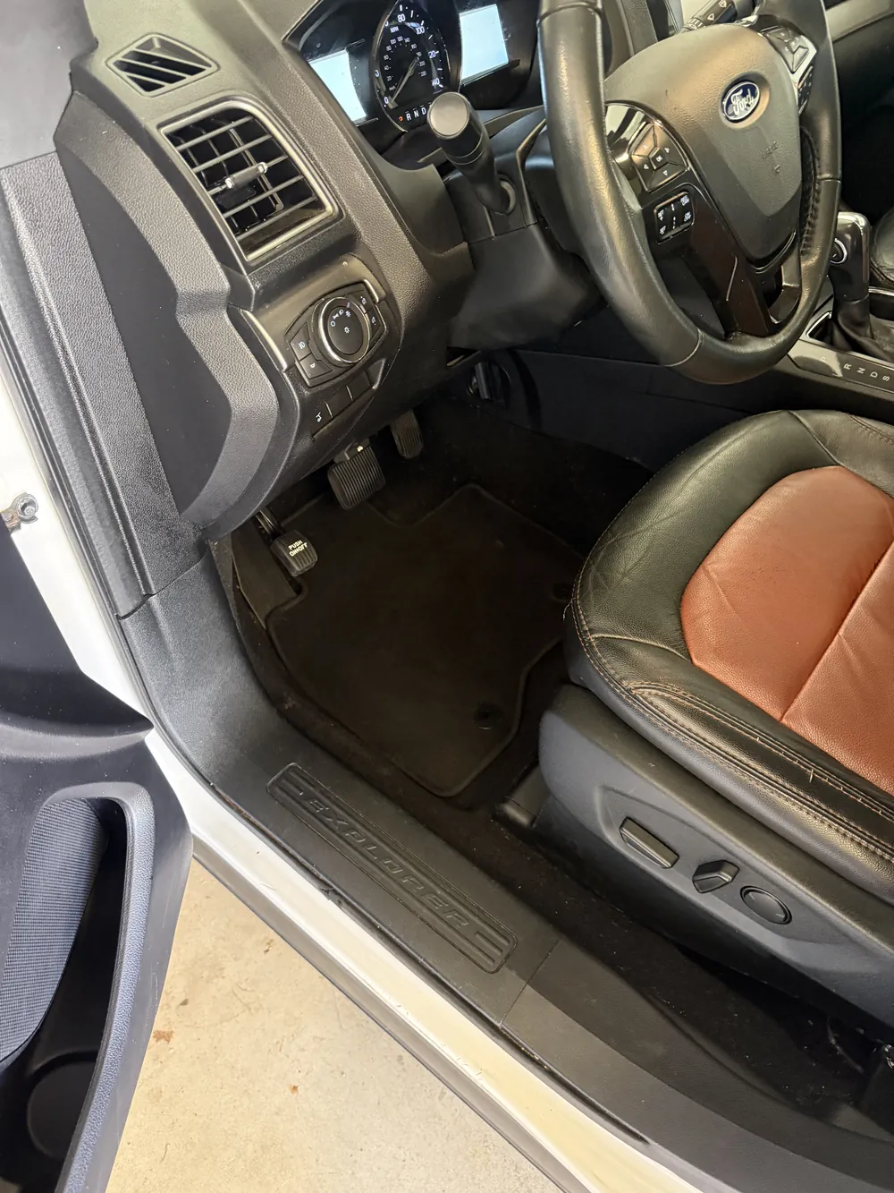 The same footwell after — carpet extracted and plastics wiped down